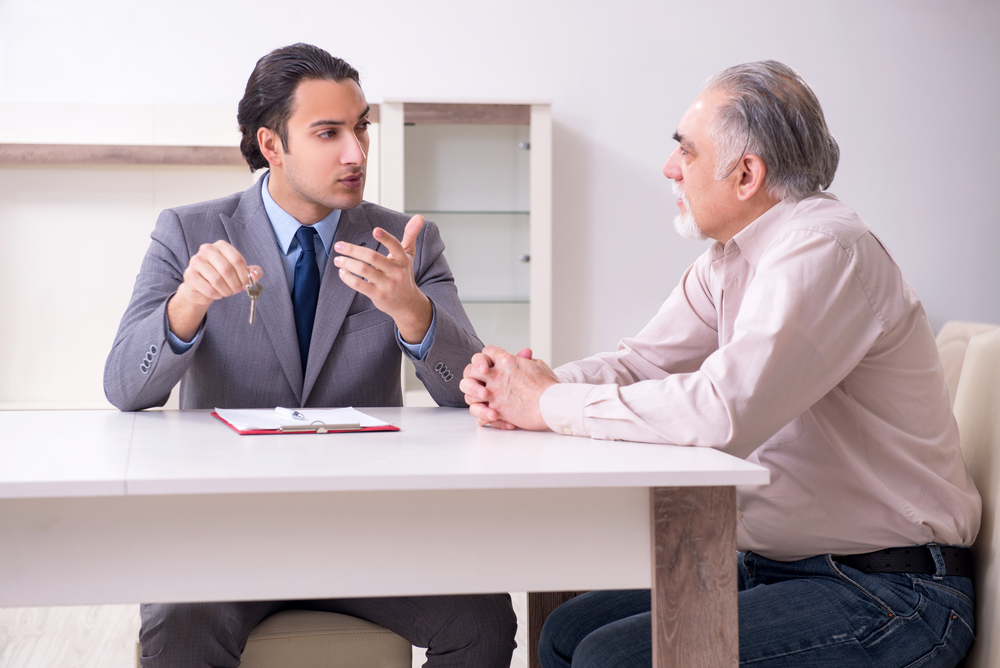 Male real estate agent and male client in the apartment