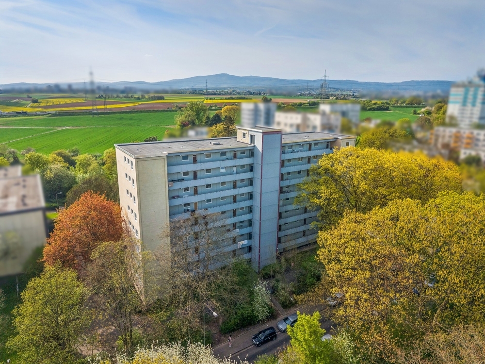 bd18d2bb48678e001ae929ad09baa0dc-1-Luftaufnahme-Mehrfamilienhaus-Strassenseite.jpg