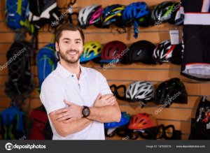 depositphotos 187839216 stock photo handsome young seller standing crossed 1024x748 1