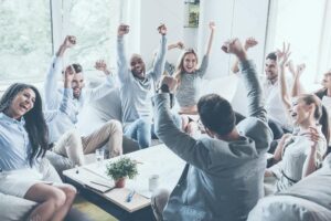 depositphotos 114079592 stock photo business people raising their arms